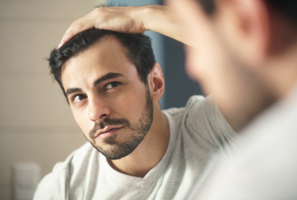 Person with beard grooming in bathroom at home